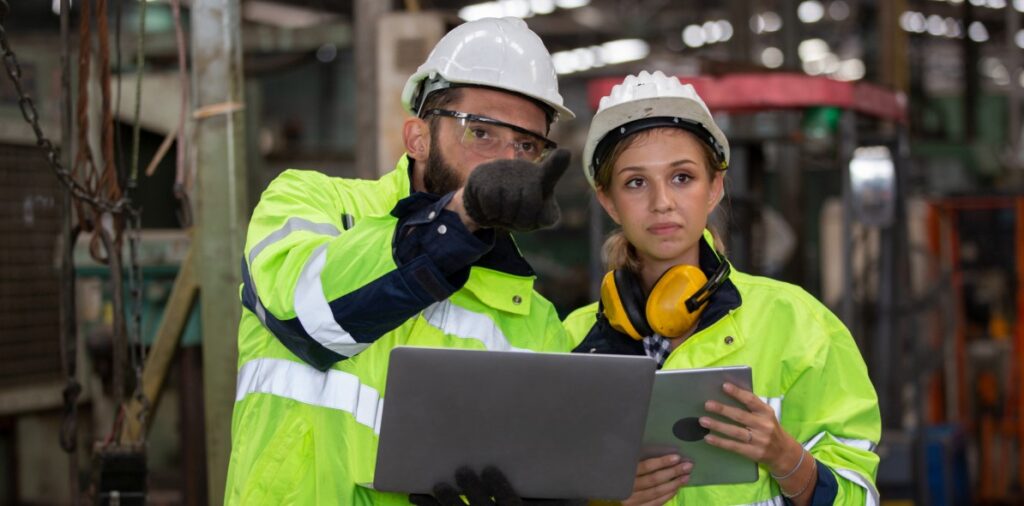 Construction surveillance technicians checking accreditation.