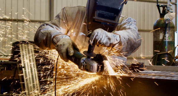 A welder inside of our controlled manufacturing evironment.