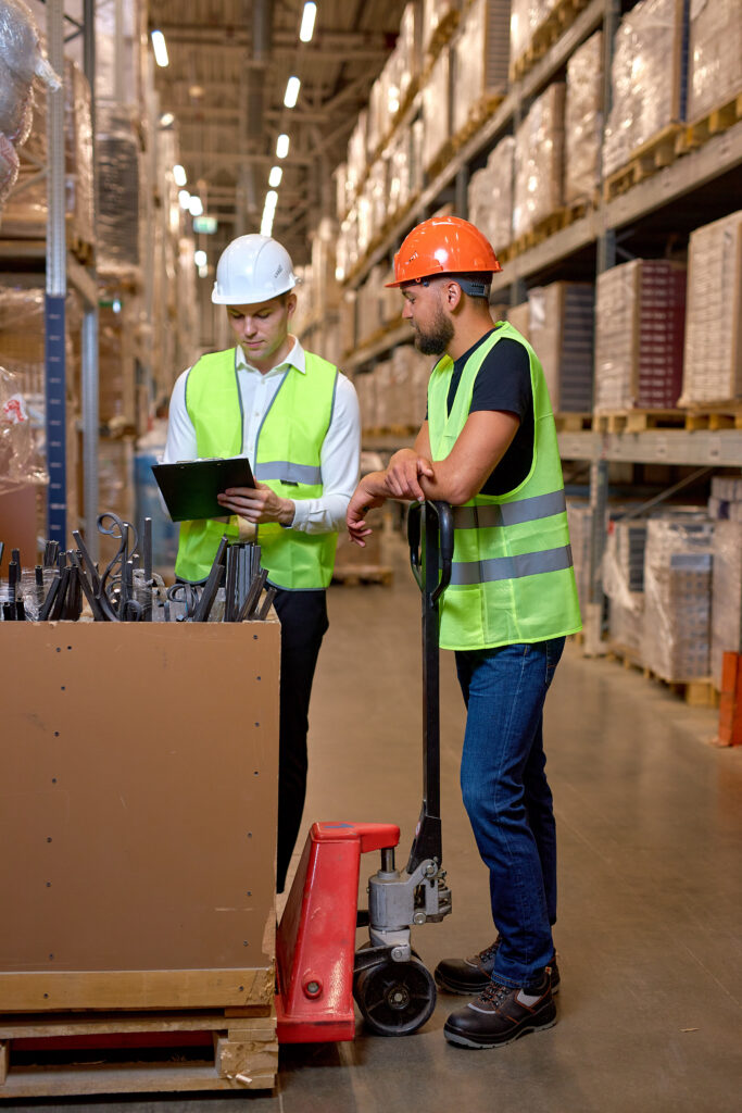 Construction surveillance technicians handling material. 